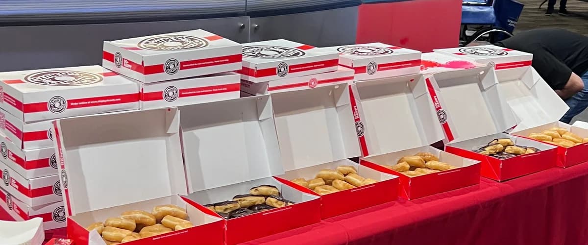Boxes of Shipley donuts and kolaches ready to serve at a large event